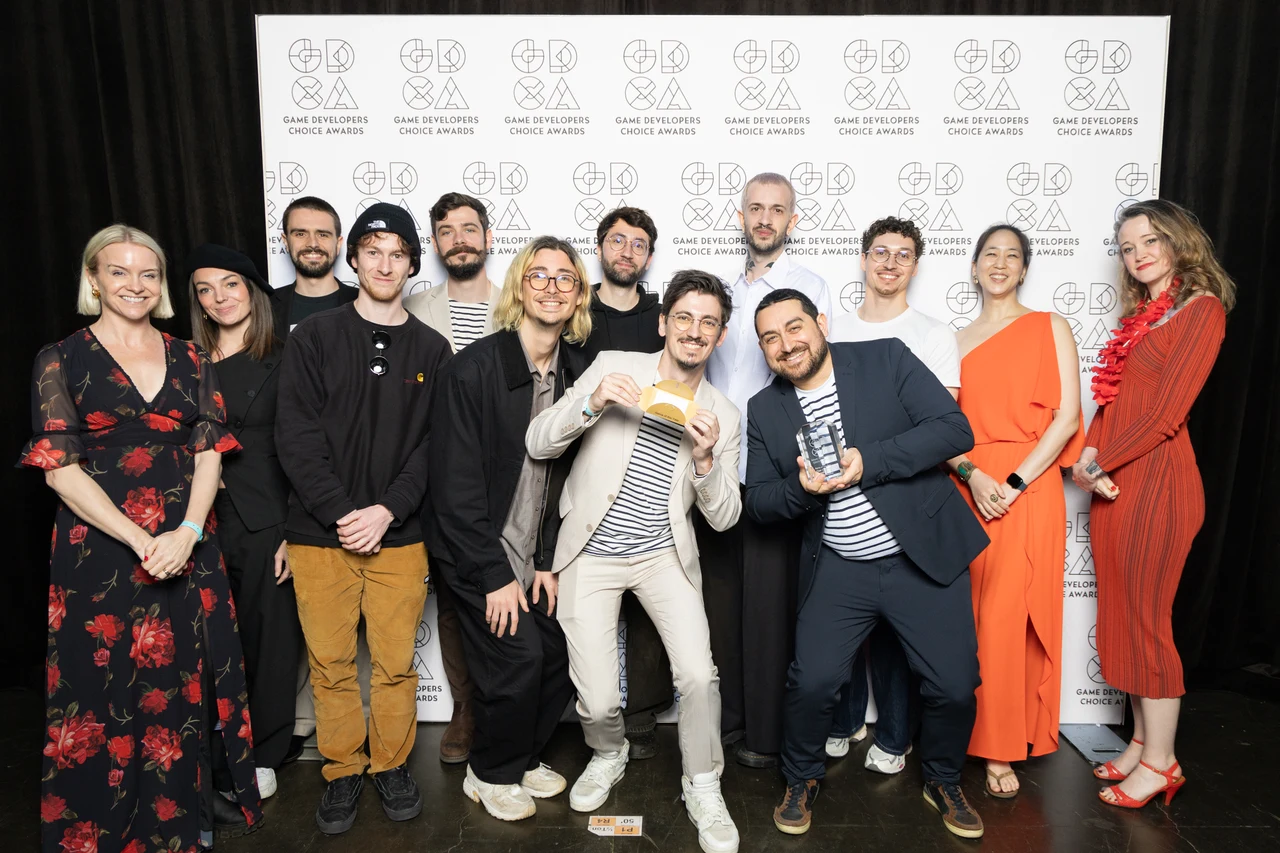 Members of Sandfall Interactive holding awards at the Game Developers Choice Awards 2026